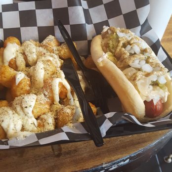 Doghouse - closest is tots with garlic ailoi and hot dog with onions, relish, sauerkraut and spicy mustard. - Hot Dogs Near Me - Orlando, Florida Doghouse - closest is tots with garlic ailoi and hot dog with onions, relish, sauerkraut and spicy mustard. - Hot Dogs Near Me - Orlando, Florida