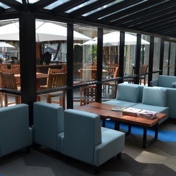 Grab and Go Cafe - seating area with tables and chairs - Coffee & Tea Near Me - Anaheim, California Grab and Go Cafe - seating area with tables and chairs - Coffee & Tea Near Me - Anaheim, California