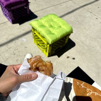 The Tuck Shop x Breadhead - a person holding a doughnut - Coffee & Tea Near Me - Toronto, Ontario The Tuck Shop x Breadhead - a person holding a doughnut - Coffee & Tea Near Me - Toronto, Ontario