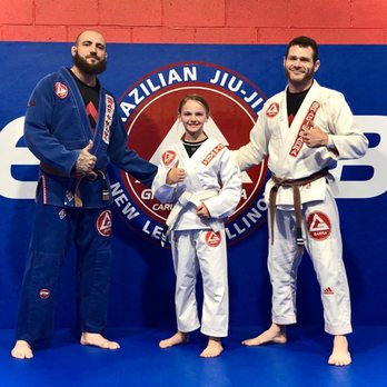Gracie Barra - Gracie Barra New Lenox Jr Champion Student earn her tip at belt grading ceremony. - Brazilian Jiu-jitsu Near Me - New Lenox, Illinois