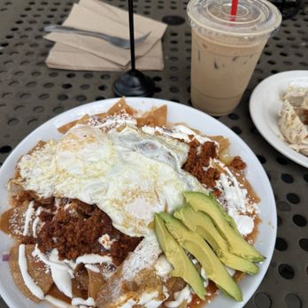 The Brunch Cafe - Chilequiles with red salsa and chorizo with a vanilla iced latte which - Cafes Near Me - Anaheim, California
