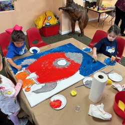 Palisades Country Day School - Using sponges and brushes to create a master piece for our annual Parents Night!