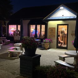 Carota's Pizza - Front of restaurant showing outdoor tables.