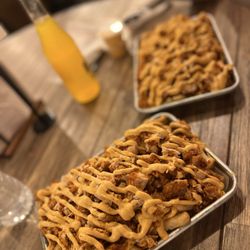 Flamin Feathers - Flamin Loaded Fries with 2 Tenders & Flamin Loaded Mac and Cheese with 2 Tenders