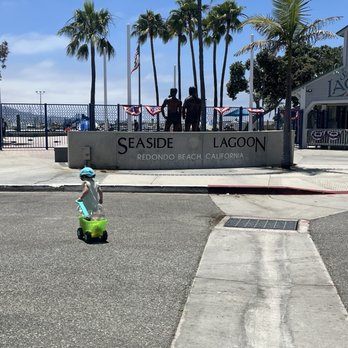 Seaside Lagoon - Baby snow, caring a wagon full of grapes - Beaches Near Me - Redondo Beach, California