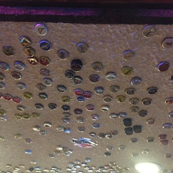 Clocktower Cellar Pub - Ceiling in bar area has beer  bottle tops. Kids thought that was cool - Pubs Near Me - Mammoth Lakes, California