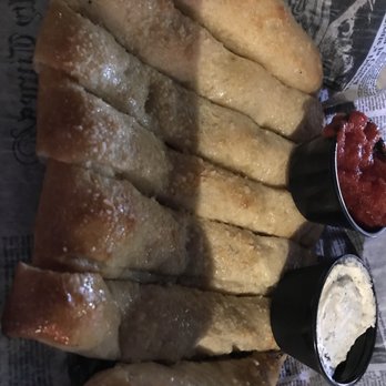 Legends Tavern & Pizzaria - Breadsticks with dipping sauces - Pizza Near Me - Fenton, Michigan Legends Tavern & Pizzaria - Breadsticks with dipping sauces - Pizza Near Me - Fenton, Michigan