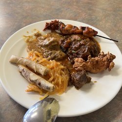 Lumpia, palabok, karekare, adobo, beef kaldereta, chicken tender and chicken skewer