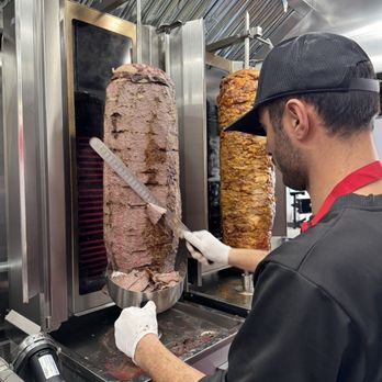 Gyro Express - a man working in a kitchen - Desserts Near Me - Brooklyn, New York