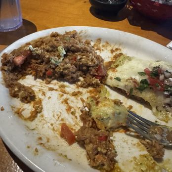 Blue Agave Cantina - Half eaten chicken enchiladas with avocado cream sauce! - Mexican Near Me - Houston, Texas Blue Agave Cantina - Half eaten chicken enchiladas with avocado cream sauce! - Mexican Near Me - Houston, Texas