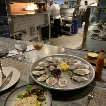 Bludorn - PEI & RI oysters on the half shell, octopus with fresh, warm hummus. Amaro Daiquiri before our bottle of wine - New American Near Me - Houston, Texas