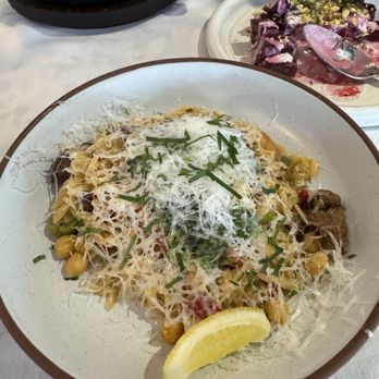 Clio - Orzo Pasta (front) Wood Roasted Beets (middle) Merguez Sausage Stuffed Dates (back left) - Mediterranean Near Me - Omaha, Nebraska Clio - Orzo Pasta (front) Wood Roasted Beets (middle) Merguez Sausage Stuffed Dates (back left) - Mediterranean Near Me - Omaha, Nebraska