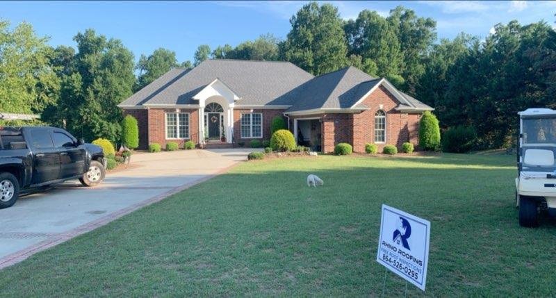 Slide of Rhino Roofing and Restoration