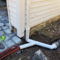 PJ's Landscape & Design - Drain grates and downspout extensions are a great way to keep your property water free.