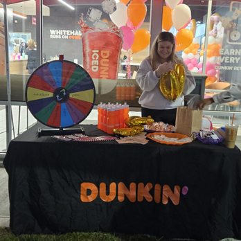 Dunkin' -  a woman behind a dunkin donut stand - Breakfast & Brunch Near Me - Columbus, Ohio