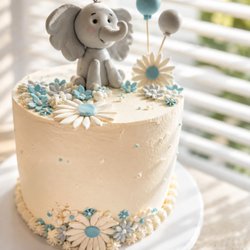 Babyshower cake customized baby elephant themed cake .