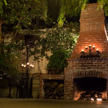 The Sepulveda Home - Fireplace lit at night - Venues & Event Spaces Near Me