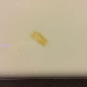 Rainbow Motel - Close up of a tub's cigarette burn. - Hotels Near Me - Chicago, Illinois