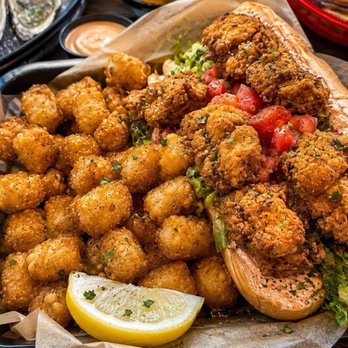 Steamhouse Lounge - The fantastic fried oyster po' boy didn't even need remoulade sauce as these tomatoes were so fresh and the breading perfecto. - Seafood Near Me - Atlanta, Georgia Steamhouse Lounge - The fantastic fried oyster po' boy didn't even need remoulade sauce as these tomatoes were so fresh and the breading perfecto. - Seafood Near Me - Atlanta, Georgia