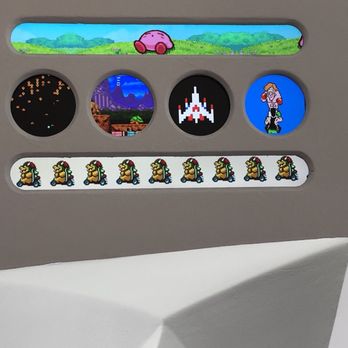 Nerdvana - Showing gifs of some games. Punch out is up there. - New American Near Me - Frisco, Texas