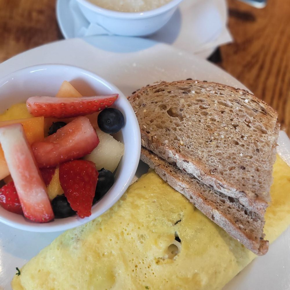 Famous Toastery - Veggie omelet, wheat toast, grits & fruit cup. - Breakfast & Brunch Near Me - Charlotte, North Carolina Famous Toastery - Veggie omelet, wheat toast, grits & fruit cup. - Breakfast & Brunch Near Me - Charlotte, North Carolina