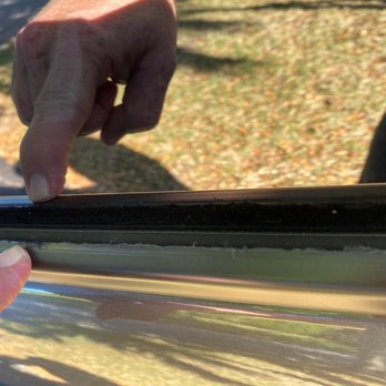 Florida Tint Solutions - The melted gaskets along the drivers side window caused by heat gun application. If you look closely you can clearly see it has been melted. - Auto Glass Services Near Me - Coral Springs, Florida Florida Tint Solutions - The melted gaskets along the drivers side window caused by heat gun application. If you look closely you can clearly see it has been melted. - Auto Glass Services Near Me - Coral Springs, Florida