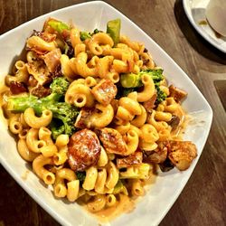 Adult Mac & Cheese: Chicken, chorizo, bacon, onions, & broccoli in a creamy cheese sauce