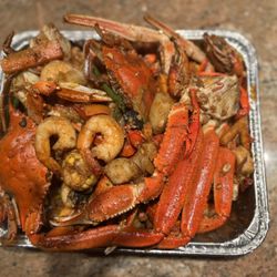 219 Jamaica Fish Market & Food - Delicious Louisiana style seafood boil in the short pan the restaurant provided for us.