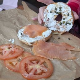 Novo Lox sandwich on a bagel, cream cheese, and smoked salmon, capers and tomatoes. Not a lot of cream cheese at all, way too many tomatoes. Novo Lox sandwich on a bagel, cream cheese, and smoked salmon, capers and tomatoes. Not a lot of cream cheese at all, way too many tomatoes.