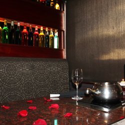 We were brought to a table decorated in rose petals & candles. Talk about setting the mood!