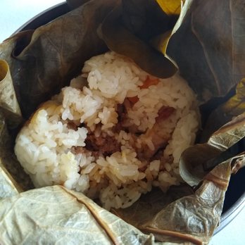 Ocean City - Unwrapped ball of sticky rice, cooked in lotus leaves. Contains duck eggs and various meats. - Dim Sum Near Me - Philadelphia, Pennsylvania Ocean City - Unwrapped ball of sticky rice, cooked in lotus leaves. Contains duck eggs and various meats. - Dim Sum Near Me - Philadelphia, Pennsylvania