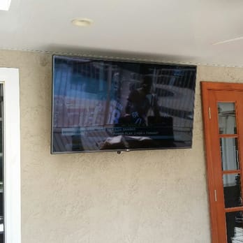 Diversified Telecommunications - Outdoor patio Led Tv installation with articulating wall mount bracket and IR Kit for remote control use of cable box inside family room. - Home Theatre Installation Near Me Diversified Telecommunications - Outdoor patio Led Tv installation with articulating wall mount bracket and IR Kit for remote control use of cable box inside family room. - Home Theatre Installation Near Me