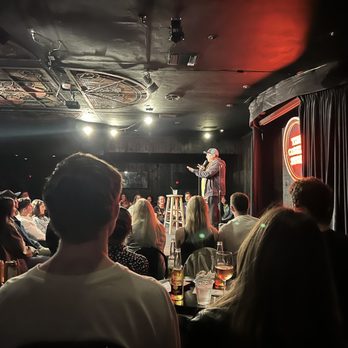 The Comedy Store - a man on a stage speaking to a crowd - Comedy Clubs Near Me - La Jolla, California