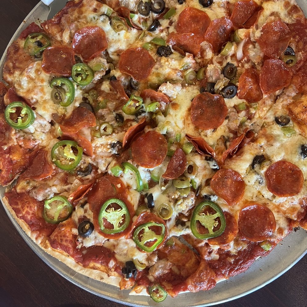 Deluxe pizza minus mushrooms, plus jalapeños & garlic.