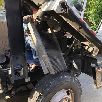 Bragg Diesel - In action removing a charged air cooler from a Capacity Yard Goat TJ700. - Commercial Truck Repair Near Me Bragg Diesel - In action removing a charged air cooler from a Capacity Yard Goat TJ700. - Commercial Truck Repair Near Me