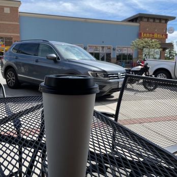Gusto Coffee Shop - a cup of coffee on a table - Coffee & Tea Near Me - Lee's Summit, Missouri
