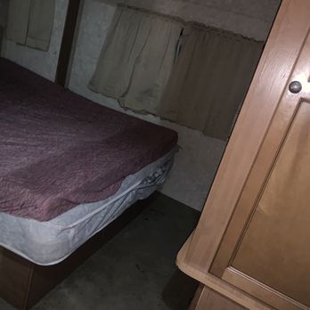 RNF Total Home Services - a bed in a small room - Home Cleaning Near Me RNF Total Home Services - a bed in a small room - Home Cleaning Near Me
