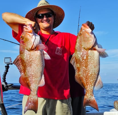Hubbard's Marina - double grouper showing off the catch during our 5 hour private charter at Hubbard's Marina http://HubbardsMarina.com - Madeira Beach, FL