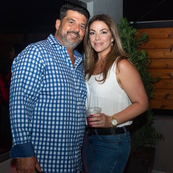 Cava Cigars - a man and a woman posing for a picture - Cigar Bars Near Me - Miami, Florida Cava Cigars - a man and a woman posing for a picture - Cigar Bars Near Me - Miami, Florida