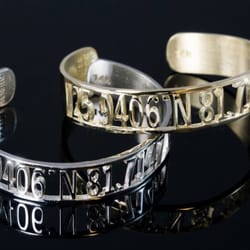 Kathein Jewelers - 14k white and yellow gold "paradise found" bangles featuring the coordinates of Marco Island. If lost, you'll always find your way home