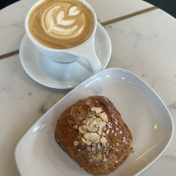 Olympia Coffee - Vanilla Latte and Chocolate Almond Croissant - Coffee & Tea Near Me - Seattle, Washington Olympia Coffee - Vanilla Latte and Chocolate Almond Croissant - Coffee & Tea Near Me - Seattle, Washington