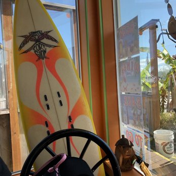 The Hukilau - Outdoor seating behind this surfboard - Sushi Bars Near Me - Florence, Oregon