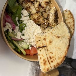 Chicken bowl with pita on the side and bakalava Chicken bowl with pita on the side and bakalava