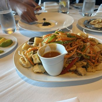 Eddie V's Prime Seafood - Calamari is on the front plate. Caviar is on the rear plate. - Seafood Near Me - Mclean, Virginia