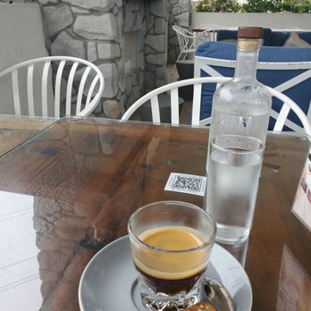 Psomi - A double espresso outside on the front patio - Bakeries Near Me - Tampa, Florida