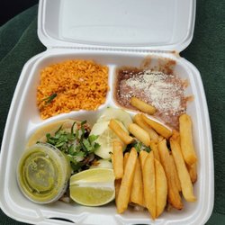 Taco Town - Tacos carnitas, Spanish rice, beans (frijoles), fries, lime, cucumber slices, green hot sauce.