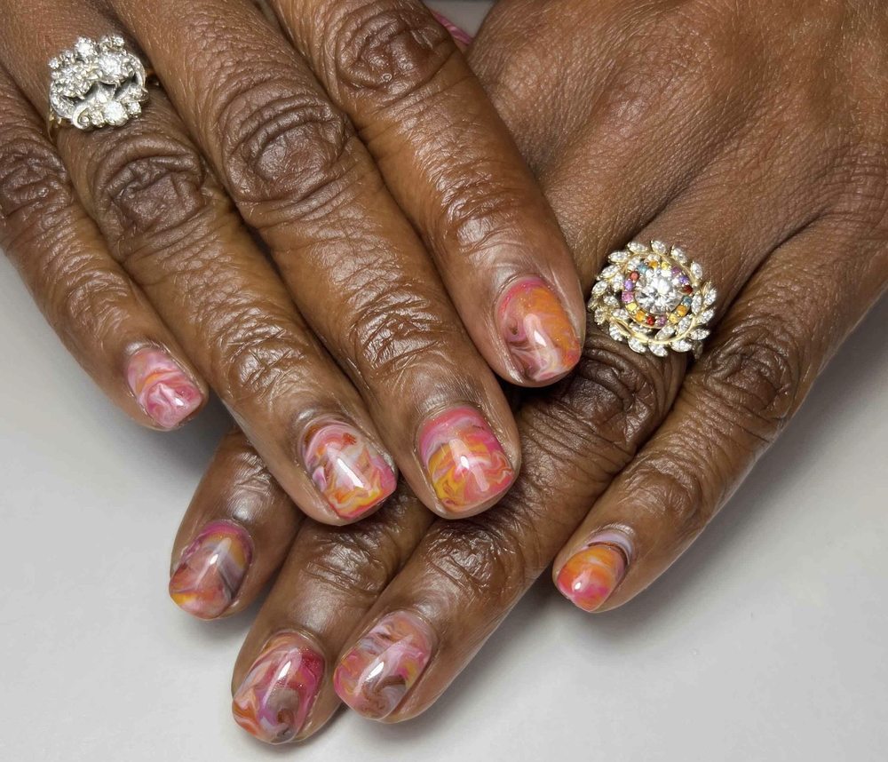 The Nail Executive Logo