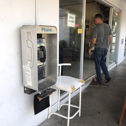 Same Day Cleaners - Gotta love businesses that would logically support a functioning public telephone.