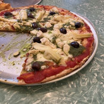 Rosey's Pizza - Greek pizza with chicken over cauliflower crust in foreground, Hatch Chili Cheeseburger pizza in background - Pizza Near Me - Carrizozo, New Mexico Rosey's Pizza - Greek pizza with chicken over cauliflower crust in foreground, Hatch Chili Cheeseburger pizza in background - Pizza Near Me - Carrizozo, New Mexico