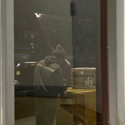 Photo of UPS Customer Center - Maspeth, NY, US. The UPS worker who hid his face when he saw I had my phone out after he denied having my package. The boxes he's facing aren't mine.